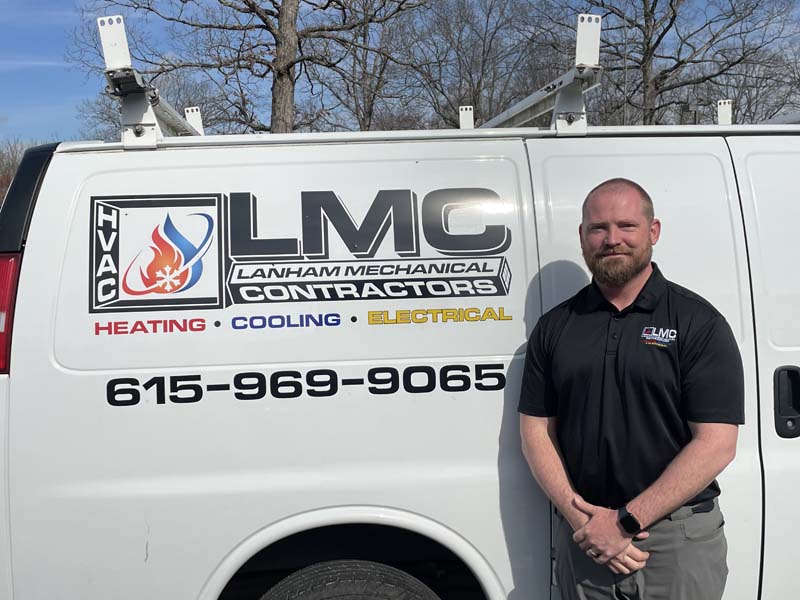 David Huffman Electrical Manager Team member in front of Lanham's AC Service Company Van