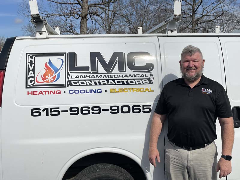 Todd Escue Electrical Manager Team member in front of Lanham's AC Service Company Van