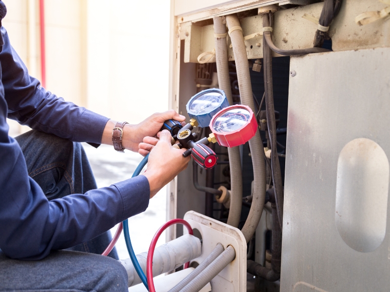 Technician holding HVAC tool for inspection and maintenance service in Goodlettsville, TN