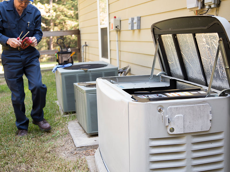 HVAC tech working on generator repair and inspection in Goodlettsville, TN