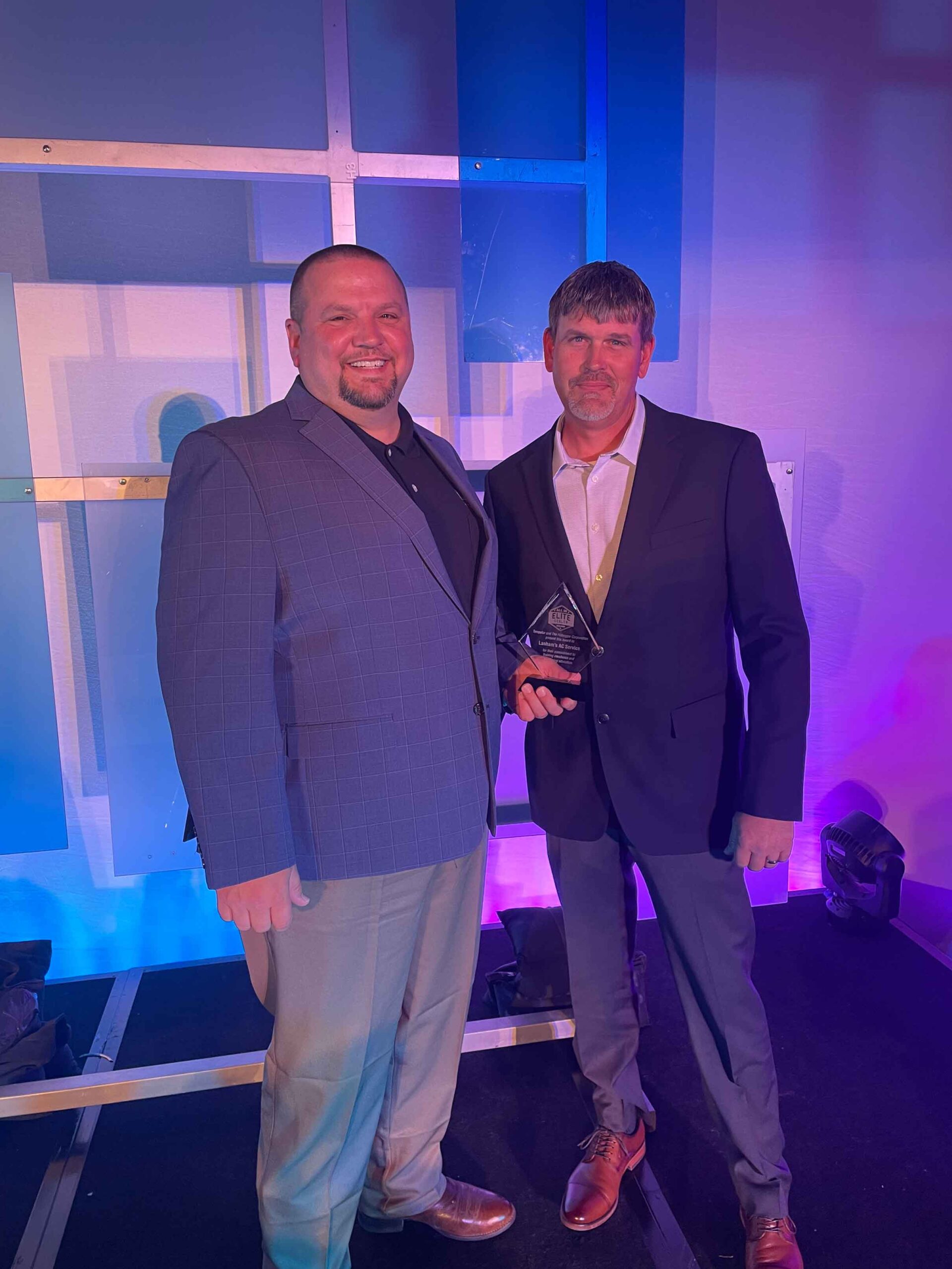 Meet The Lanham's AC Service Team receiving an award